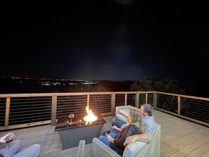 2nd Floor: Evening relaxation on the upper deck at night with wine and a view!