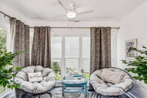 Warm and inviting sunroom with papasan chairs