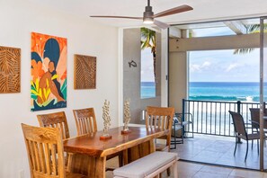 Living area with great art~ large dining table and ocean view