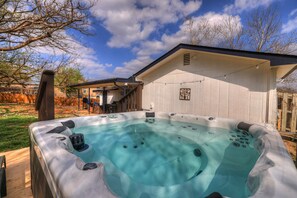 Unwind and relax in 6 person hot tub while enjoying a breathtaking sunset