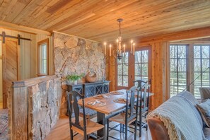 Dining table with double doors to upper deck 