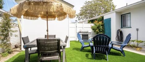 Private outdoor space with outdoor dining, lounge furniture, and a BBQ grill!