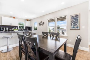 Dining table located directly off the kitchen and seats six. 