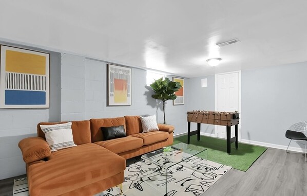 This newly finished basement/game room has everything you need for fun & laughs