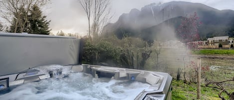 Sizeable hot tub to relax and take in the commanding mountain views.