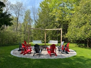 The outdoor living space offers spectacular views and an amazing firepit.