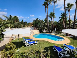Cloud, Plant, Sky, Property, Water, Swimming Pool, Building, Outdoor Furniture, Shade, Tree