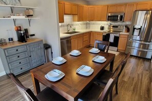 View of the Kitchen and Dining Room with Coffee Bar.