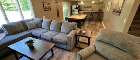Newly finished basement with bar and pool table 