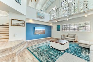 Main Living room comes with Smart 75 inch TV perfect for a movie night