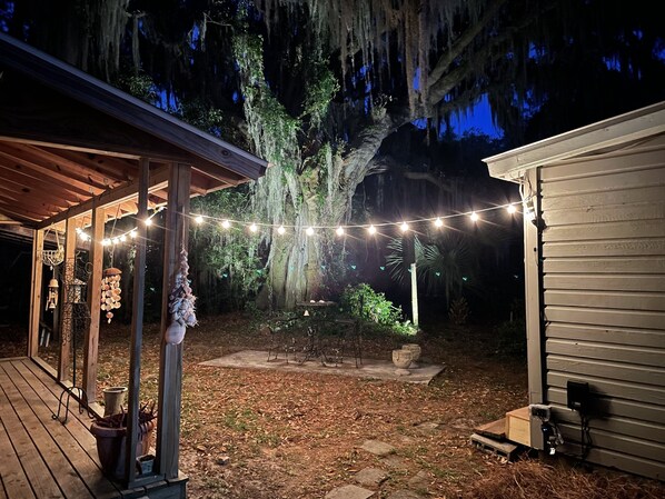 Property has a front porch with two chairs and a table.