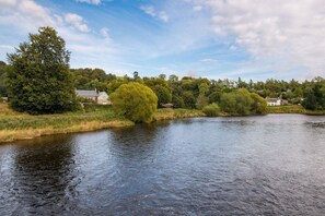 Dryburgh Farmhouse - view of the Farmhouse from the riverbank of the Tweed opposite the property