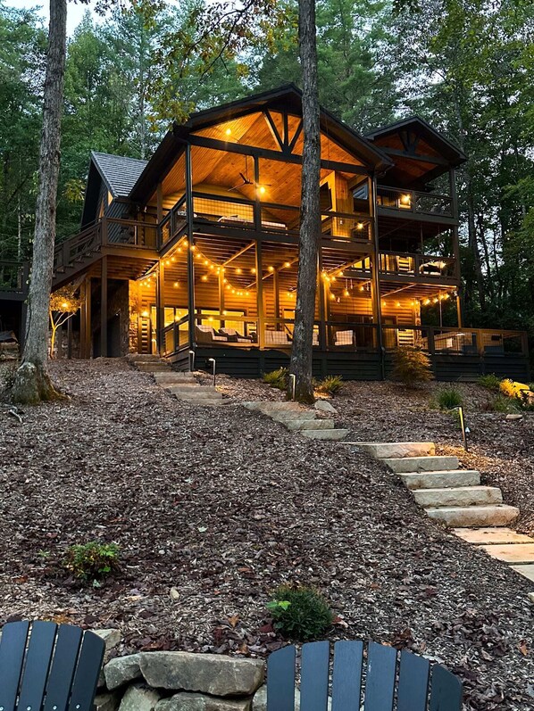 View of River Run from the yard. Grounds and porches are nicely lit!