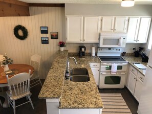 Updated Kitchen (even contains plates/bowls/silverware for kids)!