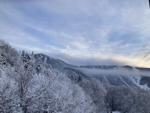 Fog creeping over Smugglers' Notch taken from the deck