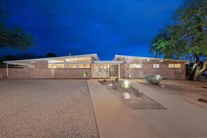 Evening view of the front of the property