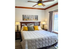 Bedroom with king-sized bed, ample clothes dresser and view of the new 
Pendry 