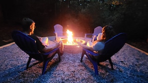 Fire pit with wood provided.