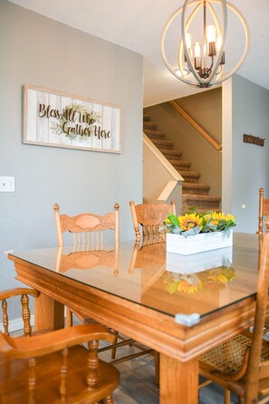 Dining room has seating for six plus a high chair.