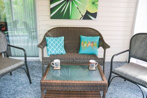 Enjoy a cup of coffee in the three-season sunroom.