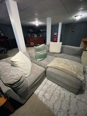 Basement; couch can be reassembled to guest liking