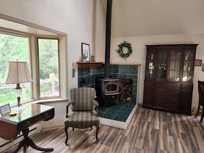 The wood stove adds cozy winter ambiance.