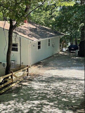 Partially paved driveway with plenty of parking space 