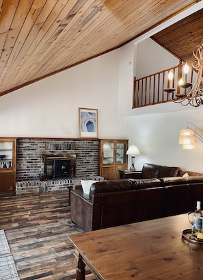 There is a beautiful open living area with cathedral ceiling.