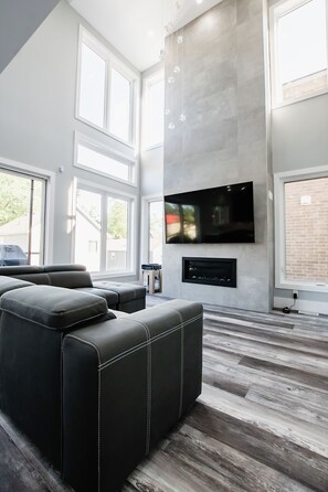 Living room with SMART TV and gas fireplace & pull out sofa

