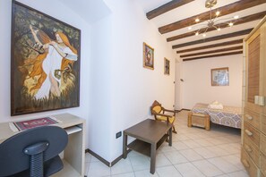 The bedroom with wardrobe and desk