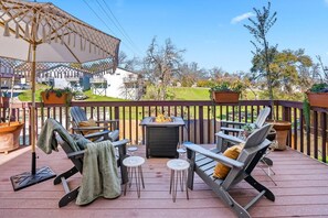 Relax by the fire table with a glass of wine, velvet pillows, and soft blankets.  Invite friends and relax on Adirondack chairs. 