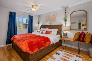 Relaxing king-sized bed with 400-count cotton sheets. Black-out curtains darken the room if needed.