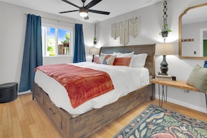 Relaxing king-sized bed with 400-count cotton sheets. Black-out curtains darken the room if needed.