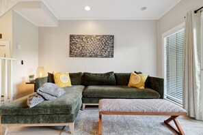Enjoy the cozy living room with a gas fireplace and a Roku TV