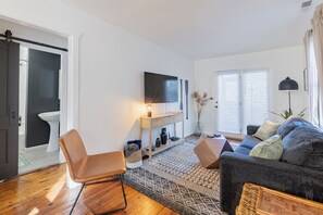 Relax and unwind in our cozy living room complete with a 55" TV.