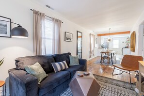 Relax and unwind in our cozy living room complete with a 55" TV.