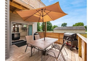 Patio off of kitchen includes charcoal grill and propane fire pit!