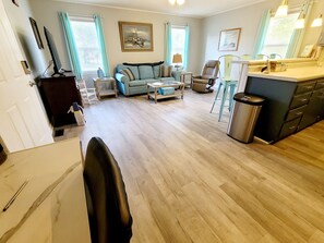 View from hallway towards kitchen and livingroom