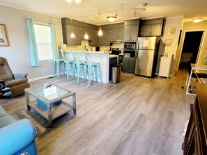 View from living room towards kitchen and bedroom