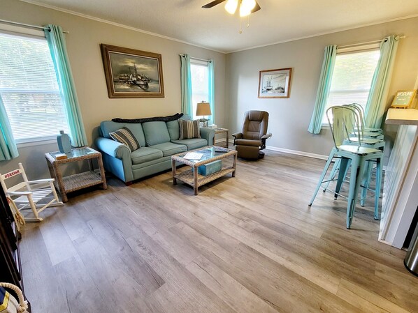 Living room with 50in SmartTV and soft leather recliner