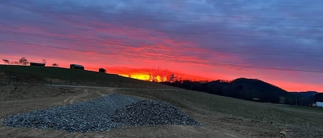 Amazing sunrise on the property! The cabins sit on the ridge to the left.