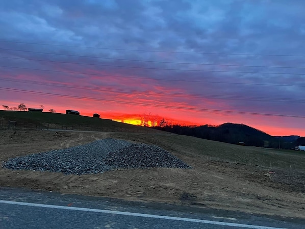 Amazing sunrise on the property! The cabins sit on the ridge to the left.