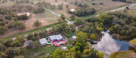 An aerial view of the home and amenities located on 3 acres. 