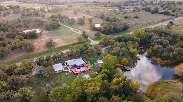 An aerial view of the home and amenities located on 3 acres. 