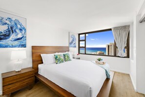 Relax in your bedroom with a king-size bed and a beautiful ocean view.