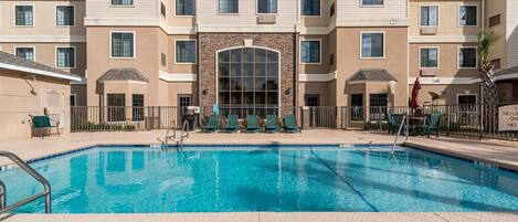 Spend time with family and friends in the outdoor pool during the summer.