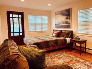 Large Bedroom with private exit leading to patio.