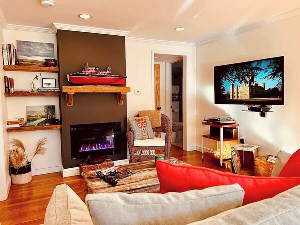 Enjoy the cozy Electric Fireplace and Large Smart TV.