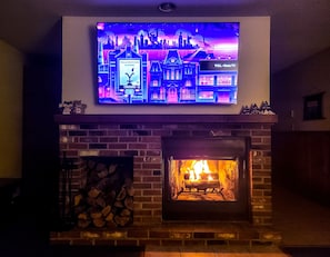 Fireplace with brand new 65" smart TV