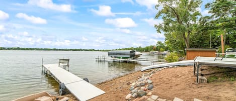 A nice beach area with a deck, pedal boat, dock, canoe all available to use 